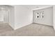 Bedroom featuring neutral carpet, white walls, and a sunlit window at 6952 Crimson Shadow St, North Las Vegas, NV 89086