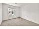 Clean and bright bedroom with neutral carpet and natural light at 6952 Crimson Shadow St, North Las Vegas, NV 89086
