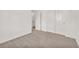 Carpeted room with white trim doors and neutral color scheme at 6952 Crimson Shadow St, North Las Vegas, NV 89086