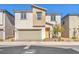 Inviting two-story home with a neutral color scheme and a two-car garage at 6952 Crimson Shadow St, North Las Vegas, NV 89086