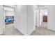 Neutral hallway providing access to bedrooms and bathrooms, showcasing seamless connectivity at 6952 Crimson Shadow St, North Las Vegas, NV 89086