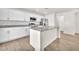 Bright kitchen with granite countertops, stainless appliances, and a center island with a sink at 6952 Crimson Shadow St, North Las Vegas, NV 89086