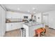 Bright kitchen featuring an island with modern appliances and wood flooring at 6952 Crimson Shadow St, North Las Vegas, NV 89086