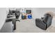 Home office featuring a recliner, desk, and natural lighting creating a functional and relaxed workspace at 6952 Crimson Shadow St, North Las Vegas, NV 89086