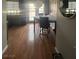 Cozy dining area featuring wood floors, seating for four, and sliding glass doors at 7098 Forest Vista St, Las Vegas, NV 89147
