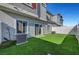 The private backyard boasts a synthetic lawn, patio, and easy access from the home via sliding glass doors at 7204 N Decatur Blvd, North Las Vegas, NV 89131