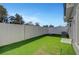 A fenced backyard features synthetic grass and a concrete patio for outdoor living and entertaining at 7204 N Decatur Blvd, North Las Vegas, NV 89131