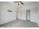 A spacious bedroom with modern ceiling fan, carpet, closet and TV mount at 7204 N Decatur Blvd, North Las Vegas, NV 89131