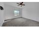 Bright bedroom with neutral walls, carpeted floors, ceiling fan, and a window at 7204 N Decatur Blvd, North Las Vegas, NV 89131