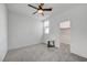 Bedroom with a large window, ceiling fan, neutral walls, and a walk-in closet at 7204 N Decatur Blvd, North Las Vegas, NV 89131