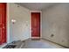 Shared front entrance area showing the red front door of unit 3, complete with a welcome mat at 7204 N Decatur Blvd, North Las Vegas, NV 89131