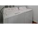 Laundry area featuring GE washer and dryer at 7204 N Decatur Blvd, North Las Vegas, NV 89131