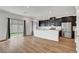 Bright living area with wood floors open to modern kitchen and backyard at 7204 N Decatur Blvd, North Las Vegas, NV 89131