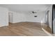 Bright living room featuring wood floors and contemporary ceiling fan at 7204 N Decatur Blvd, North Las Vegas, NV 89131
