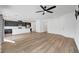 Spacious living room boasts wood floors, and open concept design with kitchen at 7204 N Decatur Blvd, North Las Vegas, NV 89131