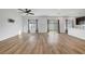 Bright, open-concept living area with beautiful hardwood floors and recessed lighting, offering ample natural light at 7204 N Decatur Blvd, North Las Vegas, NV 89131
