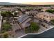 Aerial view of a home with a well-manicured lawn, solar panels, and beautiful landscaping at 7311 Velvet Sky St, Las Vegas, NV 89131