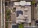 Desert home showcases solar panels, a fire pit, and a lush landscaped backyard at 7311 Velvet Sky St, Las Vegas, NV 89131