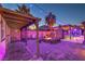 Spacious backyard with brick patio, fire pit, and comfortable seating, perfect for outdoor entertaining at 7311 Velvet Sky St, Las Vegas, NV 89131
