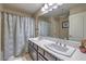 Bathroom featuring double sinks with a shower-tub combo at 7311 Velvet Sky St, Las Vegas, NV 89131