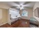Bedroom features a Murphy bed, natural lighting, and dark wood floors at 7311 Velvet Sky St, Las Vegas, NV 89131