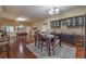 Open-concept dining room area with hardwood floors, pool table, and adjacent bar, great for entertaining at 7311 Velvet Sky St, Las Vegas, NV 89131