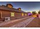 Exterior side view of the property with a brick driveway and manicured landscaping at 7311 Velvet Sky St, Las Vegas, NV 89131