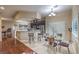 Bright, open kitchen area featuring bar seating, modern appliances, and an eat-in breakfast nook at 7311 Velvet Sky St, Las Vegas, NV 89131
