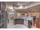 Open kitchen area with granite countertops, stainless steel appliances, and skylight at 7311 Velvet Sky St, Las Vegas, NV 89131