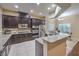 Spacious kitchen with granite countertops, stainless steel appliances, and tiled floors at 7311 Velvet Sky St, Las Vegas, NV 89131
