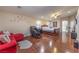 The primary suite includes hardwood floors, ceiling fan, sitting area, and ensuite bathroom at 7311 Velvet Sky St, Las Vegas, NV 89131