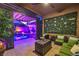 Relaxing outdoor patio with comfortable seating area and inviting pool with ambient lighting at 7311 Velvet Sky St, Las Vegas, NV 89131