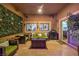 Cozy covered patio includes comfortable seating, entertainment area with grill, and views of the backyard at 7311 Velvet Sky St, Las Vegas, NV 89131