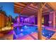 Relaxing backyard pool with lounge seating, elegant design, and lush landscaping for outdoor enjoyment at 7311 Velvet Sky St, Las Vegas, NV 89131