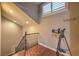 This staircase boasts wood flooring, a telescope and neutral paint, illuminated by recessed lighting at 7311 Velvet Sky St, Las Vegas, NV 89131