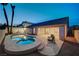 Resort-style backyard featuring a private pool and covered patio seating area at 8301 Shad Bush Ave, Las Vegas, NV 89149