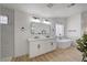 Bright bathroom with a soaking tub, walk-in shower, modern vanity, and ample natural light for a refreshing experience at 8301 Shad Bush Ave, Las Vegas, NV 89149