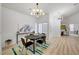 Bright dining room with modern lighting and colorful rug at 8301 Shad Bush Ave, Las Vegas, NV 89149