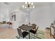 Dining area featuring modern light fixture and neutral decor at 8301 Shad Bush Ave, Las Vegas, NV 89149