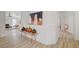 Hallway with modern art piece and light hardwood floors at 8301 Shad Bush Ave, Las Vegas, NV 89149