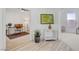 Inviting hallway featuring modern decor and access to an office space, offering a bright and functional transition area at 8301 Shad Bush Ave, Las Vegas, NV 89149
