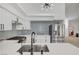 Modern kitchen with stainless appliances, light backsplash, and plenty of counter space at 8301 Shad Bush Ave, Las Vegas, NV 89149
