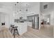 Modern kitchen boasts a sleek island, stainless steel appliances, and ample counter space at 8301 Shad Bush Ave, Las Vegas, NV 89149
