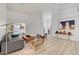 Open-concept living area with modern furnishings and light-filled ambiance at 8301 Shad Bush Ave, Las Vegas, NV 89149