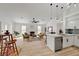 Open living space with modern kitchen, fireplace, and vaulted ceilings at 8301 Shad Bush Ave, Las Vegas, NV 89149