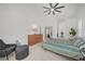 Comfortable main bedroom with vaulted ceilings, neutral decor, and a cozy seating area for relaxation at 8301 Shad Bush Ave, Las Vegas, NV 89149