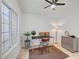 Bright office space with a modern desk setup, large window, and stylish accents for a productive work environment at 8301 Shad Bush Ave, Las Vegas, NV 89149