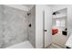 Shower features elegant marble hexagon tile and matte black hardware at 8301 Shad Bush Ave, Las Vegas, NV 89149