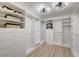 Organized walk-in closet with custom shelving and ample storage space, perfect for maximizing wardrobe organization at 8301 Shad Bush Ave, Las Vegas, NV 89149