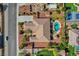 Expansive aerial view of home featuring a backyard oasis with pool, cabana, and desert landscaping at 8370 Unicorn St, Las Vegas, NV 89131